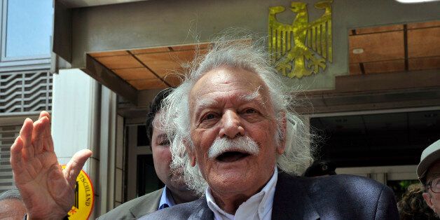 TO GO WITH AFP STORY BY CATHERINE BOITARD(FILES) In this photo taken on June 6, 2011, activist and writer Manolis Glezos speaks to the press outside the German embassy in Athens. Glezos, an emblematic figure of Greece's radical left movement and the country's fight against Nazi Germany, attended the parliament session on February 12 where government coalition parties -- at a heavy cost -- approved a new round of unpopular austerity measures to clinch a 130-billion-euro eurozone bailout. At 89 years of age, Glezos has created with Greek composer Mikis Theodorakis a new activist group named 'Elada' dedicated to fighting against the recent austerity measures approved by the Greek parliament and foreign influence in Greek politics. AFP PHOTO / LOUISA GOULIAMAKI (Photo credit should read LOUISA GOULIAMAKI/AFP/Getty Images)