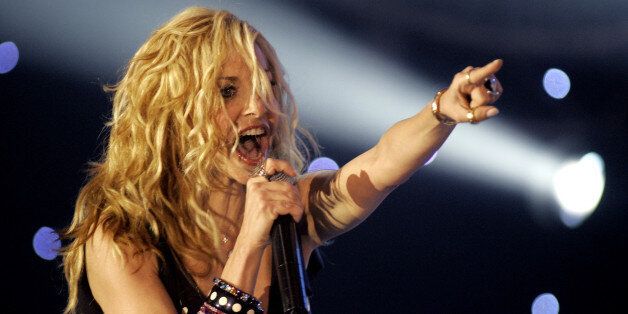 Anna Vissi performs during a Television show in Athens, late Tuesday, March 14 2006. The song