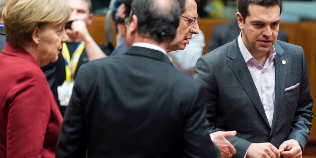 From left, German Chancellor Angela Merkel, French President Francois Hollande, Cypriot President Nicos Anastasiades and Greek Prime Minister Alexis Tsipras speak during a round table meeting at an EU summit in Brussels on Thursday, March 19, 2015. Tensions over Greece's massive financial bailout overshadowed a European Union summit amid fears that the country could accidentally drop out of the euro, triggering a crisis across the currency zone shared by 19 nations. (AP Photo/Geert Vanden Wijnga