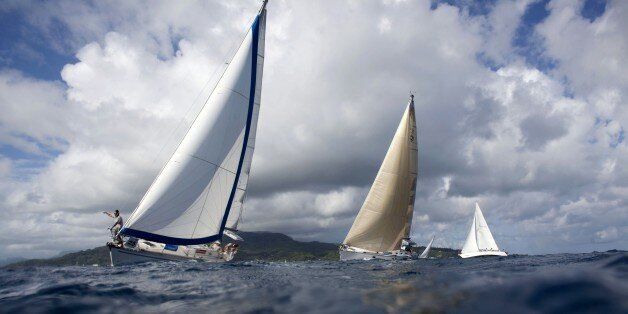 In this picture taken on May 1, 2015 shows boats racing in the twelfth edition of the Tahiti Pearl Regatta, which was held from April 30 to May 3, 2015, in the South Pacific. Over the years, the Tahiti Pearl Regatta has become the largest Pacific Islands regatta. The route takes the boats between the islands of Raiatea, Bora Bora, Huahine and Tahaa. AFP PHOTO / GREGORY BOISSY (Photo credit should read GREGORY BOISSY/AFP/Getty Images)