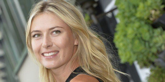 Russina tennis player Maria Sharapova poses during a photocall in Paris on May 18, 2015. AFP PHOTO/MIGUEL MEDINA (Photo credit should read MIGUEL MEDINA/AFP/Getty Images)