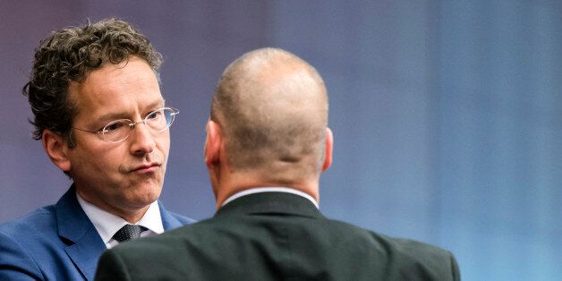 Dutch Finance Minister Jeroen Dijsselbloem, left, speaks with Greek Finance Minister Yanis Varoufakis during a round table meeting of the eurogroup finance ministers at the EU Council building in Brussels on Monday, May 11, 2015. Hopes for a deal between Greece and its European creditors at a key meeting Monday are slim, weighing on the region's stock markets as the country struggles to make upcoming debt repayments. (AP Photo/Geert Vanden Wijngaert)