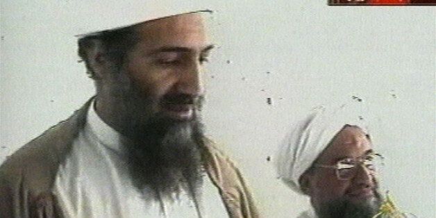 This image taken from video released by Qatar's Al-Jazeera televison broadcast on Friday Oct. 5, 2001 is said to show Osama bin Laden, the prime suspect in the Sept. 11, 2001 terrorist attacks on the United States, at an undisclosed location. Al-Jazeera did not say whether the image was taken before or after the Sept. 11 attacks or how they obtained it. At right is bin Laden's top lieutenant, Egyptian Ayman al-Zawahri. Bin Laden is believed to have been at a celebration of the union of his al-Qaida network and al-Zawahri's Egyptian Jihad group. Graphic at top right reads