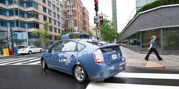 The Google self-driving car maneuvers through the streets of in Washington, DC May 14, 2012. The system on a modified Toyota Prius combines information gathered from Google Street View with artificial intelligence software that combines input from video cameras inside the car, a LIDAR sensor on top of the vehicle, radar sensors on the front of the vehicle and a position sensor attached to one of the rear wheels that helps locate the car's position on the map. As of 2010, Google has tested several vehicles equipped with the system, driving 1,609 kilometres (1,000 mi) without any human intervention, in addition to 225,308 kilometres (140,000 mi) with occasional human intervention. Google expects that the increased accuracy of its automated driving system could help reduce the number of traffic-related injuries and deaths, while using energy and space on roadways more efficiently. AFP PHOTO/Karen BLEIER (Photo credit should read KAREN BLEIER/AFP/GettyImages)