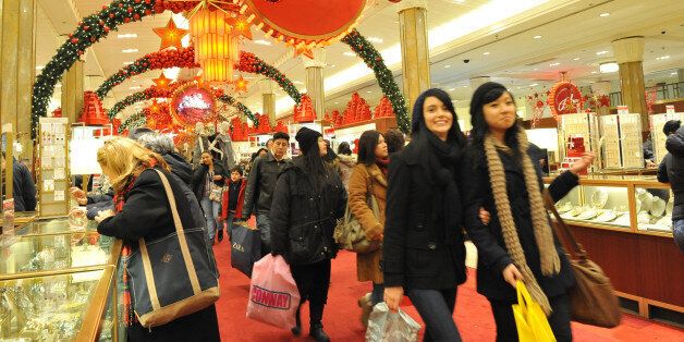 Shoppers are seen inside of Macy's flagship store at New York City's Herald Square, Sunday, Dec. 20, 2009, after it was evacuated earlier due to an escalator fire. The fire occurred in an escalator between the third and fourth floors, said Elina Kazan, a Macy's spokeswoman. The fire occurred as retail stores in Manhattan were attempting to recover from a foot of snow that fell on the city only hours before, on one of the busiest shopping day. (AP Photo/Diane Bondareff)