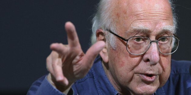 Britain's Professor Peter Higgs gestures, during a press conference, in Edinburgh, Scotland Friday, Oct. 11, 2013. Nearly 50 years after they came up with the theory, but little more than a year since the world's biggest atom smasher delivered the proof, Professor Higgs and Belgian colleague Francois Englert won the Nobel Prize in physics Tuesday for helping to explain how matter formed after the Big Bang. (AP Photo/Scott Heppell)