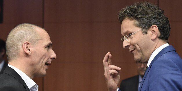 Greek Finance Minister Yanis Varoufakis (L) talks with Dutch Finance Minister and president of Eurogroup Jeroen Dijsselbloem before an Eurogroup Council meeting on May 11, 2015 at EU Headquarters in Brussels. AFP PHOTO/JOHN THYS (Photo credit should read JOHN THYS/AFP/Getty Images)