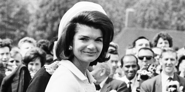 15th May 1965: Jacqueline Kennedy (1929 - 1994) attends the inauguration of a memorial to her husband John F. Kennedy in Runnymede, Surrey, nearly eighteen months after his assassination. Holding her hand is her young son, John F. Kennedy Jr. (1960 - 1999). (Photo by Michael Stroud/Express/Getty Images)