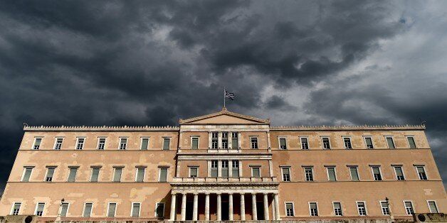 A photo taken on April 7, 2015 shows the Greek Parliament in Athens. Greek lawmakers voted on April 7 to set up a committee to examine the circumstances under which Greece agreed to bailouts totaling 240 billion euros (USD 260 billion) with the European Union and International Monetary Fund. AFP PHOTO / ARIS MESSINIS (Photo credit should read ARIS MESSINIS/AFP/Getty Images)