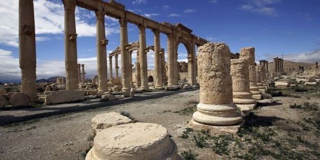 TO GO WITH AFP STORY BY SAMMY KETZA picture taken on March 14, 2014 shows a partial view of the ancient oasis city of Palmyra, 215 kilometres northeast of Damascus. Syria's fabled desert Greco-Roman oasis of Palmyra saw its last tourist in September 2011, six months after the uprising began. Its most recent visitors are violence and looting. AFP PHOTO/JOSEPH EID (Photo credit should read JOSEPH EID/AFP/Getty Images)