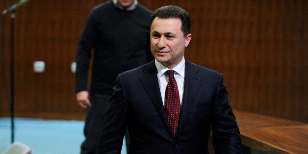 Macedonian Prime Minister Nikola Gruevski walks after a news conference at the government building in Skopje, Macedonia, on Saturday, Jan. 31, 2015. Prime Minister Gruevski has accused Saturday the leftist oppositional leader Zoran Zaev, for attempt of organizing a coup by blackmailing him with ârecorded phone conversations that discredit countryâs leadershipâ in order to agree on forming a technical government and early elections. The leader of the main leftist oppositional party Zoran Zaev was charged for âviolence against representatives of the highest state authoritiesâ. He was questioned by the investigative judge, but was not arrested and according to local media, he was ordered to hand over his passport. (AP Photo/Boris Grdanoski)