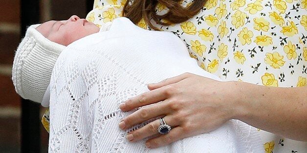 FILE - In this Saturday, May 2, 2015. file photo, Kate Duchess of Cambridge holds her newborn baby princess as they leave The Lindo Wing of St. Mary's Hospital, in London Britain's newborn princess has been named Charlotte Elizabeth Diana it was announced on Monday May 4. (AP Photo/Kirsty Wigglesworth, File)