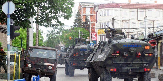 Police armored vehicles move towards the conflict zone in Kumanovo, northern Macedonia, on May 9, 2015 after clashes in which four policemen were injured. The clashes took place during a dawn police raid in a part of the town populated mainly by ethnic Albanians in what a spokesman described as an operation against an 'armed group', heightening fears of instability in the ex-Yugoslav republic after months of political crisis. AFP PHOTO / ROBERT ATANASOVSKI (Photo credit should read ROBERT ATANASOVSKI/AFP/Getty Images)