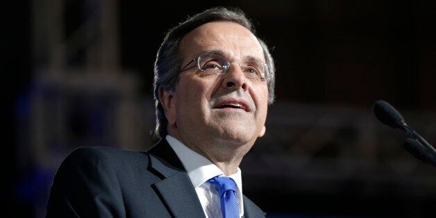 Greece's Prime Minister Antonis Samaras delivers his final campaign speech at the Taekwondo Indoor Stadium in southern Athens on Friday, Jan. 23, 2015. All opinion polls on Sunday's closely-watched national election agree: The radical left opposition Syriza party, which has vowed to rewrite the terms of Greece's international bailout, enjoys a lead of at least 4 percentage points over Prime Minister Antonis Samaras' conservatives. (AP Photo/Lefteris Pitarakis)