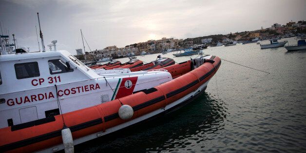 LAMPEDUSA, ITALY - APRIL 24: Coastguard vessels float in the harbour on April 24, 2015 in Lampedusa, Italy. Migrants continue to arrive in Lampedusa from North Africa. Hundreds of migrants are believed to have perished over the last week as they attempted to cross the Mediterranean from Libya to Italy in order to seek refuge. (Photo by Dan Kitwood/Getty Images)