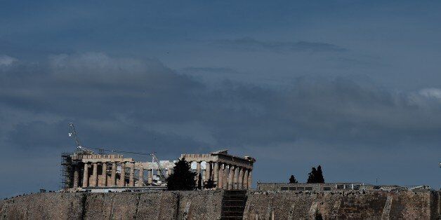 A view of the ancient temple of Parthenon atop the Acropolis hill in Athens on March 18, 2015. Greece has responded sharply to apparent pressure from the EU not to pass on March 18 a 'humanitarian crisis' law that would provide free electricity and food stamps for the poorest households. AFP PHOTO / ARIS MESSINIS (Photo credit should read ARIS MESSINIS/AFP/Getty Images)