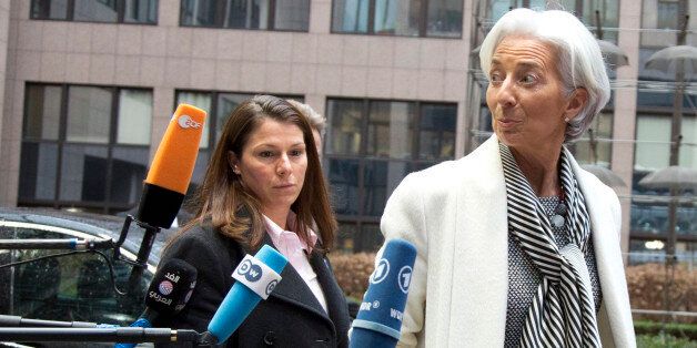 Managing Director of the International Monetary Fund Christine Lagarde, right, arrives for a meeting of eurogroup finance ministers in Brussels on Friday, Feb. 20, 2015. Eurozone finance ministers meet for a crucial day of talks Friday to see whether a Greek debt relief proposal is acceptable to Germany and other nations using the common currency. (AP Photo/Virginia Mayo)
