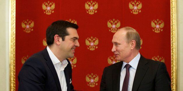 Russian President Vladimir Putin, right, and Greek Prime Minister Alexis Tsipras shake hands during a signing ceremony in the Kremlin in Moscow, Russia, Wednesday, April 8, 2015. Russian President Vladimir Putin said the leader of Greece did not ask for financial aid during an official visit, easing speculation that Athens might use its relations with Moscow to gain advantage in bailout talks with European creditors. (AP Photo/Alexander Zemlianichenko, Pool)