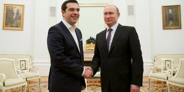 Russian President Vladimir Putin, right, welcomes visiting Greek Prime Minister Alexis Tsipras in Moscow's Kremlin, Russia, Wednesday, April 8, 2015. Alexis Tsipras is in Russia on an official visit. (AP Photo/Alexander Zemlianichenko, Pool)