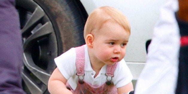 CIRENCESTER, UNITED KINGDOM - JUNE 15: (EMBARGOED FOR PUBLICATION IN UK NEWSPAPERS UNTIL 48 HOURS AFTER CREATE DATE AND TIME) Prince George of Cambridge plays with a polo mallet as he and his mother Catherine, Duchess of Cambridge watch Prince William, Duke of Cambridge & Prince Harry play in the Jerudong Trophy charity polo match at Cirencester Park Polo Club on June 15, 2014 in Cirencester, England. (Photo by Max Mumby/Indigo/Getty Images)