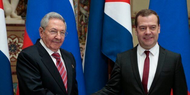 Russian Prime Minister Dmitry Medvedev, right, and Cuban President Raul Castro shake hands at their meeting in Moscow, Russia, Wednesday, May 6, 2015. (AP Photo/Ivan Sekretarev)