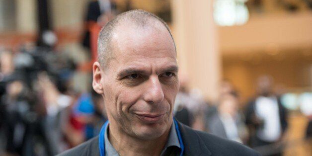 Greek Finance Minister Yanis Varoufakis waits for the International Monetary and Financial Committee (IMFC) family photo at the IMF/WB Spring Meetings in Washington, DC, on April 18, 2015. AFP PHOTO/NICHOLAS KAMM (Photo credit should read NICHOLAS KAMM/AFP/Getty Images)