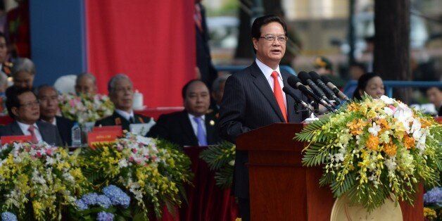 Vietnam's Prime Minister Nguyen Tan Dung delivers a speech during a parade marking the 40th anniversary of the fall of Saigon (former name of Ho Chi Minh City) in Ho Chi Minh City on April 30, 2015. Vietnam marked the 40th anniversary of Saigon's fall with a huge military parade to celebrate the moment communist forces ended a decades-long conflict and delivered a painful blow to American morale and military prestige. AFP PHOTO / HOANG DINH Nam (Photo credit should read HOANG DINH NAM/AFP/Getty Images)