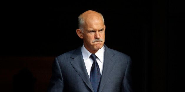 FILE In this Saturday, Oct. 1, 2011, file photo Greece's Prime Minister George Papandreou awaits the Emir of Qatar, , for a meeting at the Prime Minister's official residence in Athens. Former Greek prime minister George Papandreou has revealed plans to create a new political party â a development that will see him break away from the once powerful PanHellenic Socialist Movement founded by his father. Papandreou, 62, announced the plan on his website Friday, Jan. 2, 2015, ahead of a sna