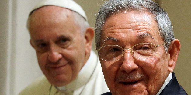 Pope Francis, left, looks at Cuban President Raul Castro during a private audience at the Vatican, Sunday, May 10, 2015. Cuban President Raul Castro has been welcomed at the Vatican by Pope Francis, who played a key role in the breakthrough between Washington and Havana aimed at restoring U.S.-Cuban diplomatic ties. (AP Photo/Gregorio Borgia, Pool)