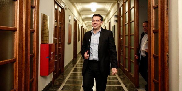 Greece's Prime Minister Alexis Tsipras arrives for a cabinet meeting at the parliament in Athens, Greece, Thursday, April 30, 2015. Greece started a new round of talks with bailout negotiators Thursday, insisting it was not ready to make key concessions despite a major looming debt repayment. (AP Photo/Yorgos Karahalis)