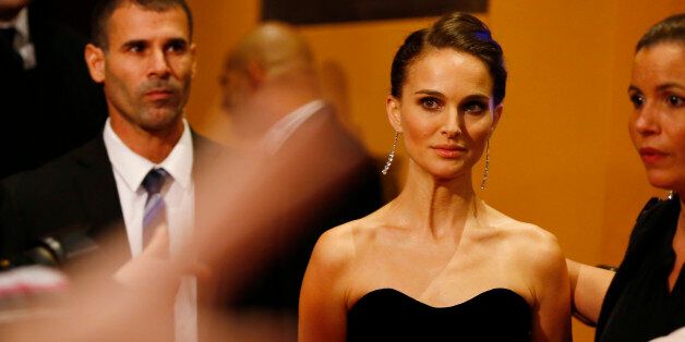 Actress Natalie Portman poses for photographers on the red carpet of the film Knight of Cups at the 2015 Berlinale Film Festival in Berlin Sunday, Feb. 8, 2015. (AP Photo/Axel Schmidt)