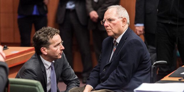 German Finance Minister Wolfgang Schaeuble, right, speaks with Dutch Finance Minister Jeroen Dijsselbloem during a meeting of Eurogroup finance ministers at the EU Council building in Brussels on Monday, Feb. 16, 2015. Greeceâs radical left government and its European creditors headed into new talks Monday on the debt-heavy countryâs stuttering bailout program, but expectations are low despite a fast-approaching deadline for some kind of deal. (AP Photo/Geert Vanden Wijngaert)