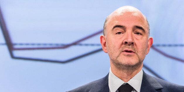 EU Commissioner for Economic and Financial Affairs, Taxation and Customs Pierre Moscovici addresses the media on the winter economic forecast at the European Commission headquarters in Brussels on Thursday, Feb. 5, 2015. (AP Photo/Geert Vanden Wijngaert)