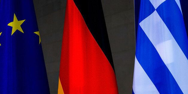 BERLIN, GERMANY - MARCH 23: The flags of the European Union, Greece and Germany stays beside as German Chancellor Angela Merkel and Greek Prime Minister Alexis Tsipras speak to the media upon his arrival for talks at the Chancellery on March 23, 2015 in Berlin, Germany. The two leaders are meeting as relations between the Tsipras government and Germany have soured amidst contrary views between the two countries on how Greece can best work itself out of its current economic morass. (Photo by Carsten Koall/Getty Images)