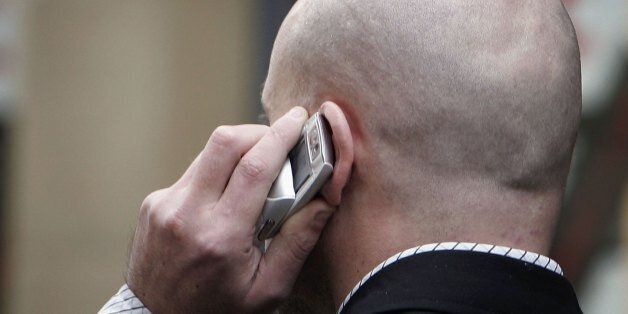 MANCHESTER, UNITED KINGDOM - JANUARY 20: An unidentified man uses his mobile telephone without ear piece on January 20, 2006 in Manchester, England. A longterm study has found that there is no link between mobile phone use and tumours. The study of 2,782 people in the UK showed that excessive use matched other surveys concluding the results. (Photo by Christopher Furlong/Getty Images)