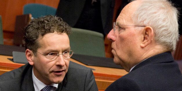 German Finance Minister Wolfgang Schaeuble, right, speaks with Dutch Finance Minister Jeroen Dijsselbloem during a meeting of Eurogroup finance ministers at the EU Council building in Brussels on Monday, Feb. 16, 2015. Greeceâs radical left government and its European creditors headed into new talks Monday on the debt-heavy countryâs stuttering bailout program, but expectations are low despite a fast-approaching deadline for some kind of deal. (AP Photo/Virginia Mayo)