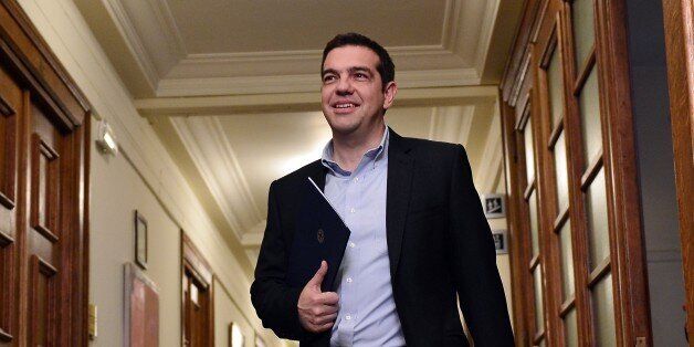 Greek Prime Minister Alexis Tsipras arrives for a cabinet meeting at the Greek parliament in Athens on April 30, 2015. Greece resumed talks with its international creditors on critically-needed bailout funds as officials warned that time was running out for a deal. AFP PHOTO / LOUISA GOULIAMAKI (Photo credit should read LOUISA GOULIAMAKI/AFP/Getty Images)