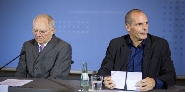 German Finance Minister Wolfgang Schaeuble , left, and his counterpart from Greece Yanis Varoufakis address the media during a news conference in Berlin, Germany, Thursday Feb.5,2015. (AP Photo/dpa/Michael Kappeler)