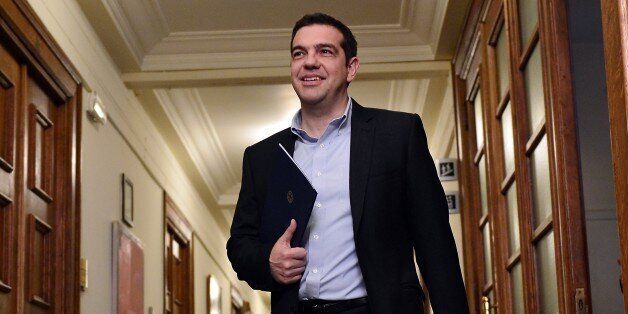 Greek Prime Minister Alexis Tsipras arrives for a cabinet meeting at the Greek parliament in Athens on April 30, 2015. Greece resumed talks with its international creditors on critically-needed bailout funds as officials warned that time was running out for a deal. AFP PHOTO / LOUISA GOULIAMAKI (Photo credit should read LOUISA GOULIAMAKI/AFP/Getty Images)
