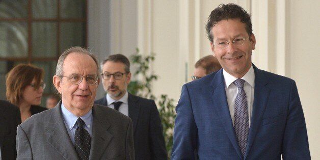 Italian Economy Minister Pier Carlo Padoan (L) welcomes Dutch Finance Minister and president of the Eurogroup, Jeroen Dijsselbloem prior their meeting on May 8, 2015 in Rome. AFP PHOTO / TIZIANA FABI (Photo credit should read TIZIANA FABI/AFP/Getty Images)