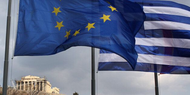 ATHENS, GREECE - FEBRUARY 17: The EU and Greek flags fly in front of the Parthenon on the Acropolis on February 17, 2012 in Athens, Greece. Following a meeting on Wednesday, finance ministers across the Eurozone are calling for greater scrutiny and oversight of Greece's proposed budget cuts in order to approve the latest 130 billion euro bailout package. The package, which is anticipated to be finalised on February 20, 2012, is essential for Greece to avoid defaulting on a 14.5 billion euro bond it is due to repay in mid-March. (Photo by Oli Scarff/Getty Images)