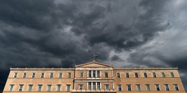 A photo taken on April 7, 2015 shows the Greek Parliament in Athens. Greek lawmakers voted on April 7 to set up a committee to examine the circumstances under which Greece agreed to bailouts totaling 240 billion euros (USD 260 billion) with the European Union and International Monetary Fund. AFP PHOTO / ARIS MESSINIS (Photo credit should read ARIS MESSINIS/AFP/Getty Images)
