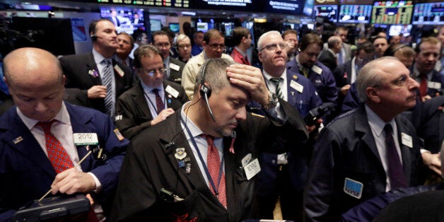 Traders work on the floor of the New York Stock Exchange, Tuesday, March 24, 2015. U.S. stocks were mixed in early trading Tuesday, as investors assessed the latest news on consumer prices and some company earnings. (AP Photo/Richard Drew)