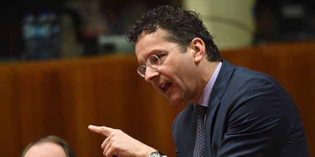 Eurogroup President and Dutch Finance Minister Jeroen Dijsselbloem (R) gestures during an economic and financial affairs council (ECOFIN) at the European Council in Brussels, March 10, 2015. AFP PHOTO / EMMANUEL DUNAND (Photo credit should read EMMANUEL DUNAND/AFP/Getty Images)