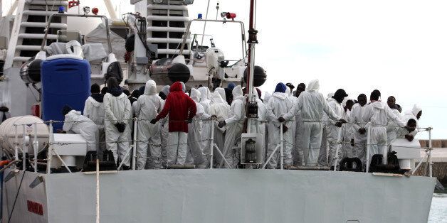 Migrants wait to disembark from an Italian Coast Guard ship after being rescued in Porto Empedocle, Sicily, southern Italy, Saturday, Feb. 14, 2015. The U.N. High Commissioner for Refugees, Save the Children, Amnesty International and other aid groups blasted the new EU-backed rescue patrol as insufficient for the task at hand. The European Union took over Mediterranean patrols after Italy phased out its robust Mare Nostrum operation in November. Mare Nostrum (Our Seas) had been launched in 2013 after 360 migrants drowned off the coast of the Sicilian island of Lampedusa. But the EU's Triton mission only operates a few miles off Europe's coast â its job is to patrol Europe's borders â whereas Mare Nostrum patrols took Italian rescue ships up close to Libya's coast. (AP Photo/Francesco Malavolta)