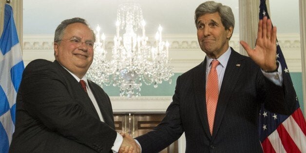 US Secretary of State John Kerry and Greek Foreign Minister Nikos Kotzias (L) speak to the media prior to meetings at the State Department in Washington, DC, April 20, 2015. AFP PHOTO / SAUL LOEB (Photo credit should read SAUL LOEB/AFP/Getty Images)