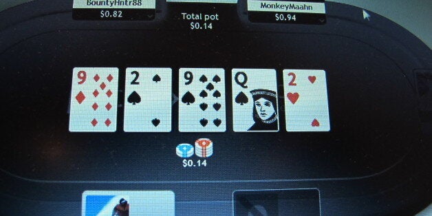 A computer screen in Atlantic City, N.J., shows an Internet poker game under way on an international site of the partypoker website on Nov. 19, 2013. The company is partnered with the Borgata Hotel Casino and was allowed to begin offering Internet gambling throughout New Jersey on Monday, Nov. 25, 2013. (AP Photo/Wayne Parry)