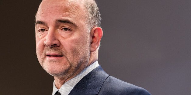 EU Commissioner for Economic and Financial Affairs, Taxation and Customs Pierre Moscovici addresses the media on the winter economic forecast at the European Commission headquarters in Brussels on Thursday, Feb. 5, 2015. (AP Photo/Geert Vanden Wijngaert)