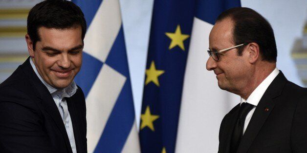 French president Francois Hollande (R) and Greece's Prime Minister Alexis Tsipras are seen during a press conference at the Elysee presidential palace, on February 4, 2015 in Paris. AFP PHOTO MARTIN BUREAU (Photo credit should read MARTIN BUREAU/AFP/Getty Images)