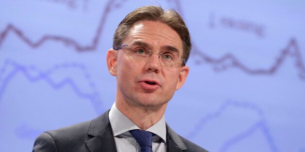 European Commissioner for Jobs, Growth, Investment and Competitiveness Jyrki Katainen addresses the media at the European Commission headquarters in Brussels, Tuesday, Nov. 4, 2014. European Union slashed its economic growth forecasts for the bloc on Tuesday, indicating the recovery will remain sluggish amid problems for the biggest economies, particularly France. (AP Photo/Yves Logghe)
